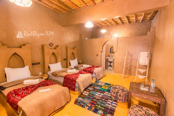 Discover Riad Ouzina TGM, an authentic desert riad in Ouzina Desert near Merzouga. Enjoy camel trekking, desert excursions, stargazing.