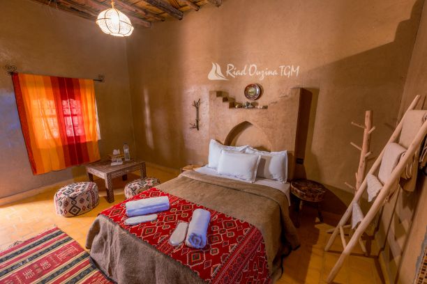 Discover Riad Ouzina TGM, an authentic desert riad in Ouzina Desert near Merzouga. Enjoy camel trekking, desert excursions, stargazing.